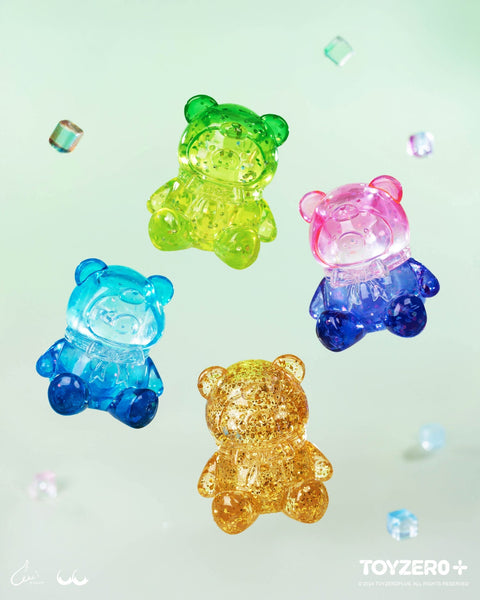 Four translucent piggy bears in glittering green, pink, blue, and gold sparkle like candy gummies suspended mid-air.