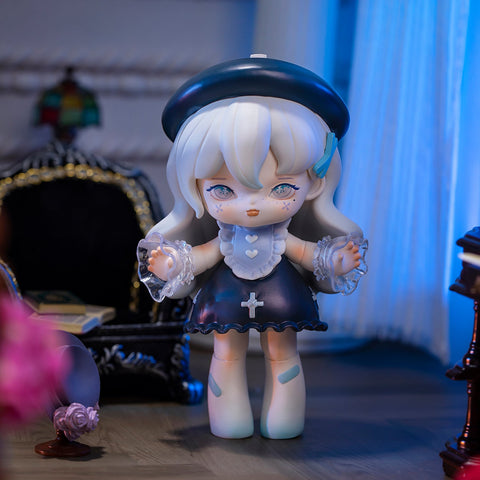 A 3D-rendered MISYA Incredible Mansion Series figure stands in an elegant, gothic-style room with dim lighting. The character has long, wavy silver hair, soft blue eyes, and a delicate, melancholic expression. She wears a dark navy dress with white lace details, a cross emblem, translucent frilled sleeves, and a matching beret. The background features antique furniture, a black velvet chair, and scattered objects, enhancing the mysterious, vintage ambiance of the scene.