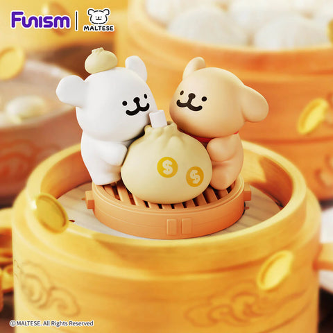 Maltese and friend hugging a giant "money bag" bun atop a golden bamboo steamer.