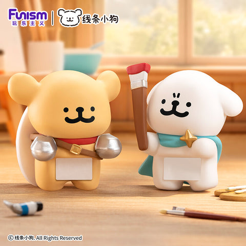 A white pup in a teal cape holding a giant paintbrush next to a golden pup in silver armor with a shield.