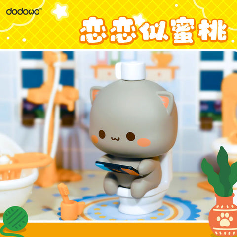 Gray cat Huihui sits on a toilet, holding a tablet, surrounded by orange bathroom accessories in a playful everyday scene.