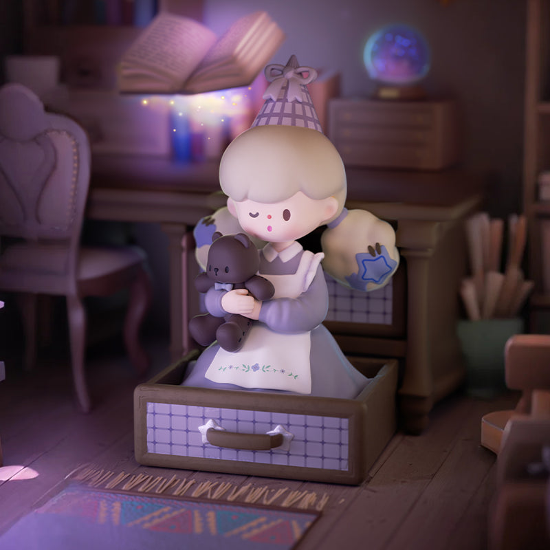 A gentle figure sits inside a wooden drawer holding a small teddy bear, surrounded by books, star motifs, and a softly glowing globe. Warm lamplight and drifting sparkles make the moment feel like a bedtime spell of comfort, curiosity, and childlike wonder.