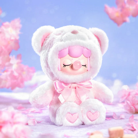 A dreamy collectible figurine from the "Nanci Colorful Chocolate Cutie Bears" plush series features a character dressed in a fluffy white and pink bear suit with a matching satin bow. The figure has a serene expression with closed eyes and a bubblegum bubble, while heart-shaped details accent its plush paws. Surrounded by delicate cherry blossoms and a pastel sky, this secret hidden chaser edition exudes an ethereal and sweet charm, capturing a soft and whimsical aesthetic.