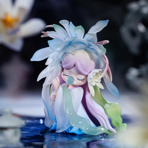 A secret figurine from the Nanci “Flower Stories” blind box series, this character represents the epiphyllum flower. She has flowing pastel hair in soft pink, lavender, and green tones, and wears a headdress of delicate translucent petals. Eyes closed, she holds a bubble at her lips, surrounded by a dreamy, moonlit water garden, evoking quiet beauty and mystery.