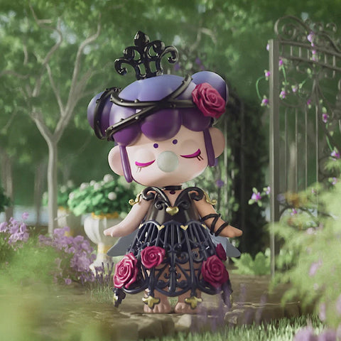 A captivating collectible figurine from the "Nanci Secret Garden" series features a mysterious character dressed in an intricate black wrought-iron-inspired gown adorned with deep red roses. Her purple hair is styled elegantly with a matching iron crown, and she exudes a regal yet enigmatic aura with closed eyes and a bubblegum bubble. Set against an ornate garden gate surrounded by lush greenery and flowers, this figure embodies gothic elegance and timeless beauty.