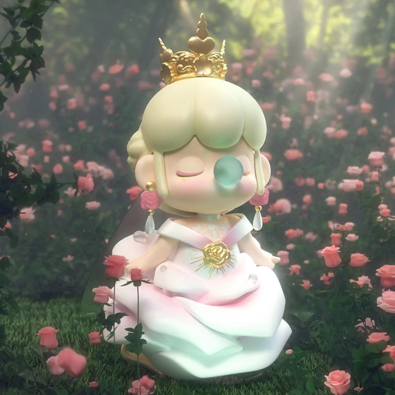 Nanci in a white dress that resembles a rose. There is a gold crown that sits on top of her head. 