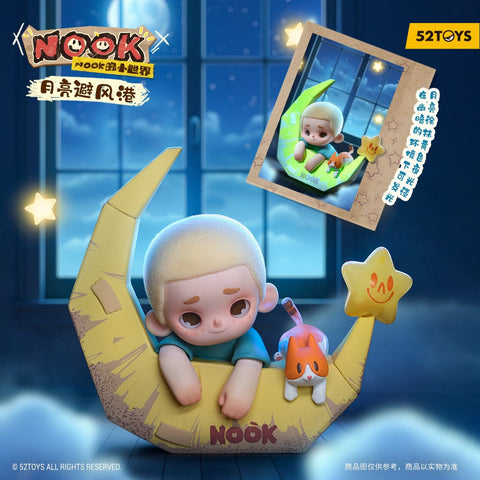 A sleepy child figurine with short blond hair leans over the edge of a yellow cardboard crescent moon boat marked with the Nook logo. An orange-and-white cat rests beside them as the boat floats in a dark blue night scene. Glowing star shapes and a large window frame the cozy setting.