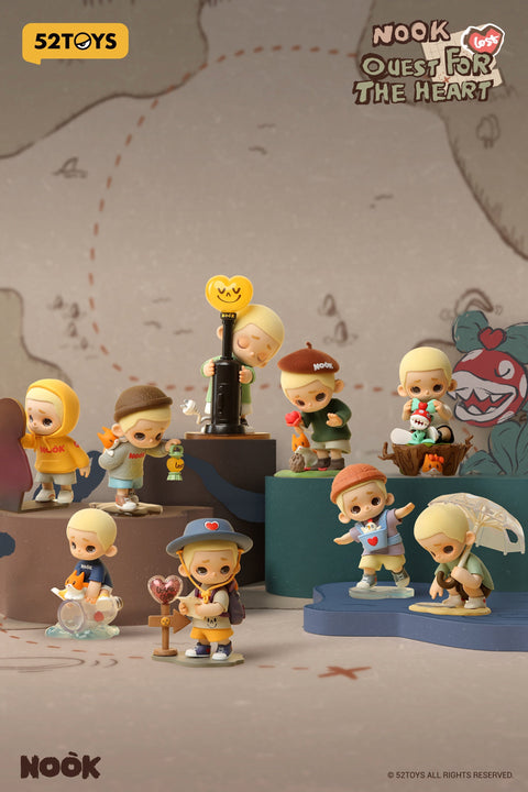 Promotional image for 52TOYS’ Nook “Quest for the Heart” blind box series featuring nine stylized figurines of a blond boy in various themed outfits and poses. The characters are displayed on tiered platforms with whimsical props, including a lantern, umbrella, and heart-shaped signs, all set against a treasure map-style background.