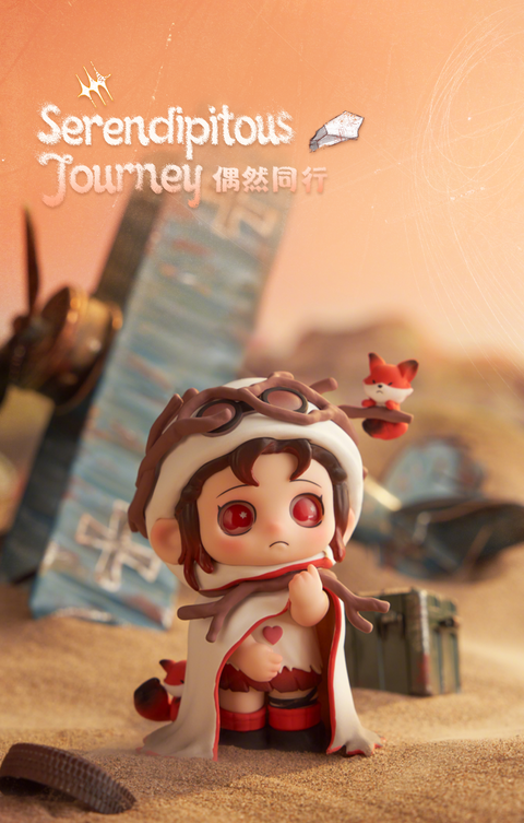 An OONA figurine stands in desert sand wearing aviator goggles and a white hooded cloak with red trim. A small fox companion hovers nearby, while a fallen airplane lies behind them, creating a scene of exploration and chance encounters.
