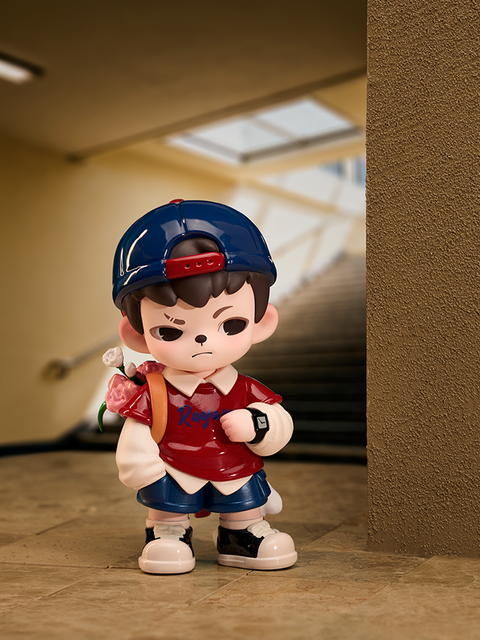 A figure with brown hair and a red cap stands in a stairwell, holding a pink flower in one hand and wearing a red shirt with blue shorts. The background shows steps leading upward into bright daylight.