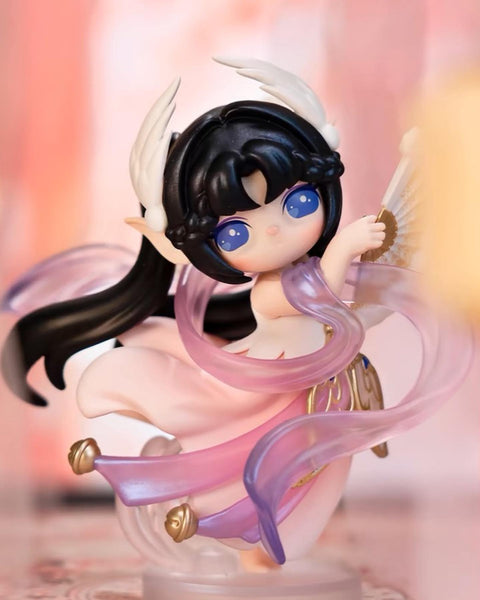 The Suri Dancer figure in a graceful pose with flowing pink translucent sashes and a traditional white fan.