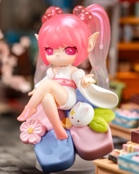The Dessert Xi Shi figure featuring vibrant pink pigtails, a white and pink traditional outfit, and a cute white rabbit companion resting on a floral base.