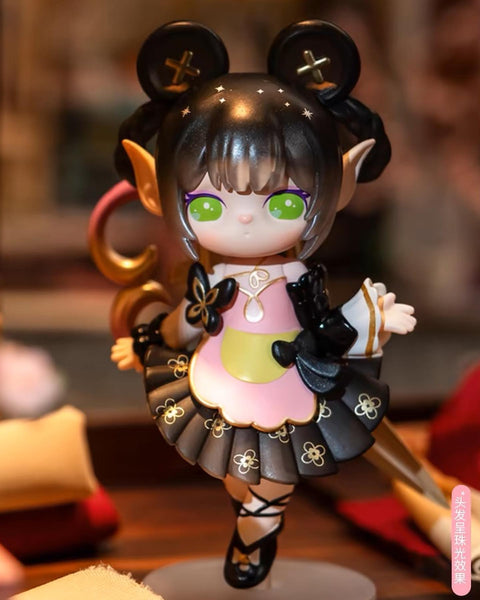 Suri as the Pocket Tailor, featuring black hair with starry highlights, green eyes, and a detailed black and pink dress with golden floral patterns.