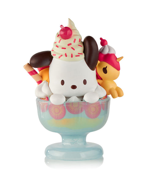 A white Pochacco figure sitting inside a blue glass sundae dish filled with whipped cream and cherries, with a small yellow Unicorno figure tucked into the side as a topping.