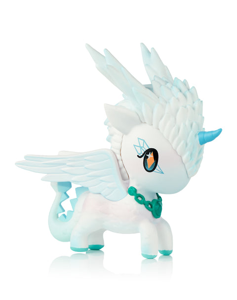 This image shows the Tokidoki Unicorno Mystical Dragon “Feather Dragon,” a white and icy turquoise dragon-unicorn figure with layered feather-like mane textures, blue wings, a turquoise horn, and a matching collar. Its soft matte body and sculpted details stand out against a plain white background.