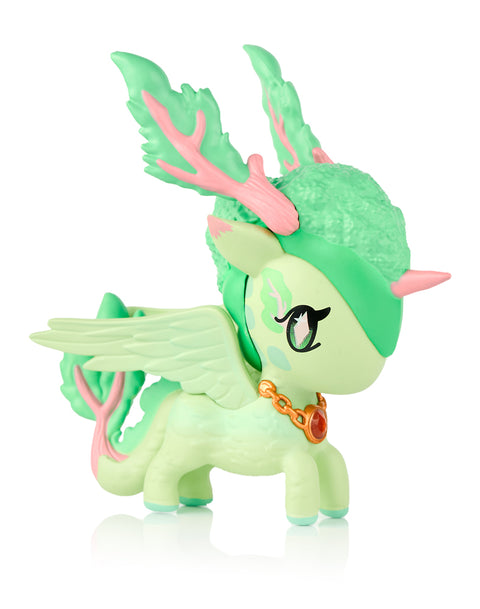 This image shows the Tokidoki Unicorno Mystical Dragon “Flora Dragon,” a mint green and pink dragon-unicorn with leaf-shaped antlers, pastel wings, a curled tail, and a gold chain necklace. Its matte body features subtle nature-inspired patterns, shown against a white background.