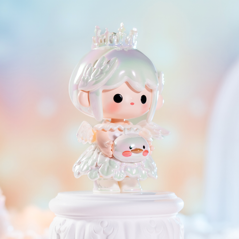 A radiant white-haired figure in an iridescent pearl dress wears a delicate crown with angelic wings. She holds a shimmering swan companion with blush cheeks. The shimmering pastel background enhances her divine aura, making the figure feel ethereal, magical, and filled with celestial grace.