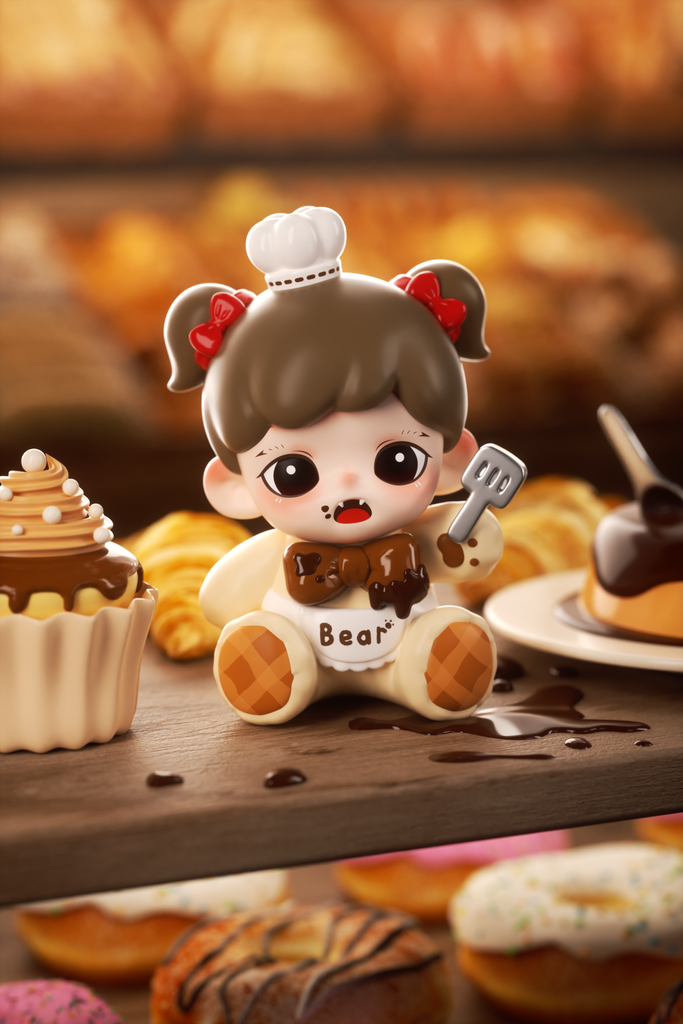 A small figurine of a girl with pigtails and red bows dressed as a chocolate bear sits among pastries. She has a white bib labeled “Bear,” a chef’s hat, and chocolate dripping on her outfit. Surrounding her are cupcakes, donuts, and bread under warm bakery lighting.